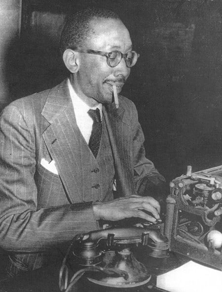 Ted Poston at typewriter