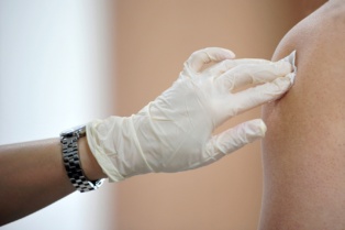 Injection with hospital sanitary gloves on.