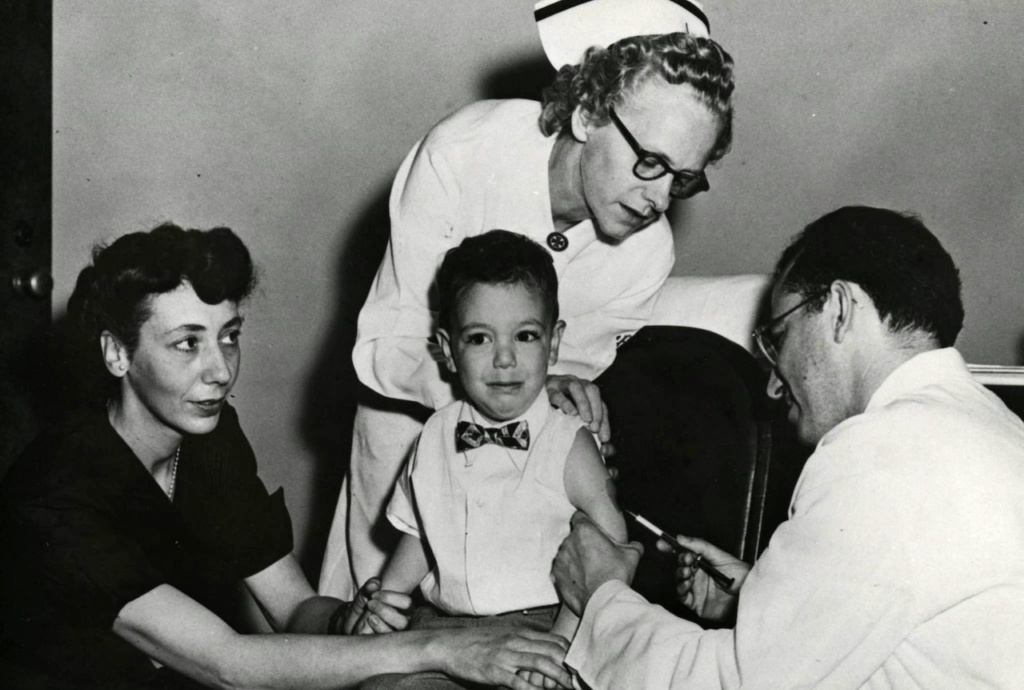 child receiving polio vaccine