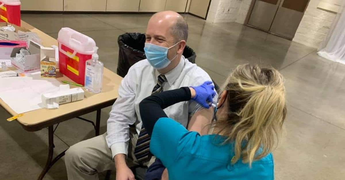 chris bentzel receives vaccine
