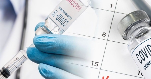 covid vaccine bottle needle feature
