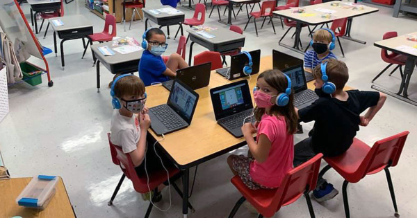 students in school wearing masks