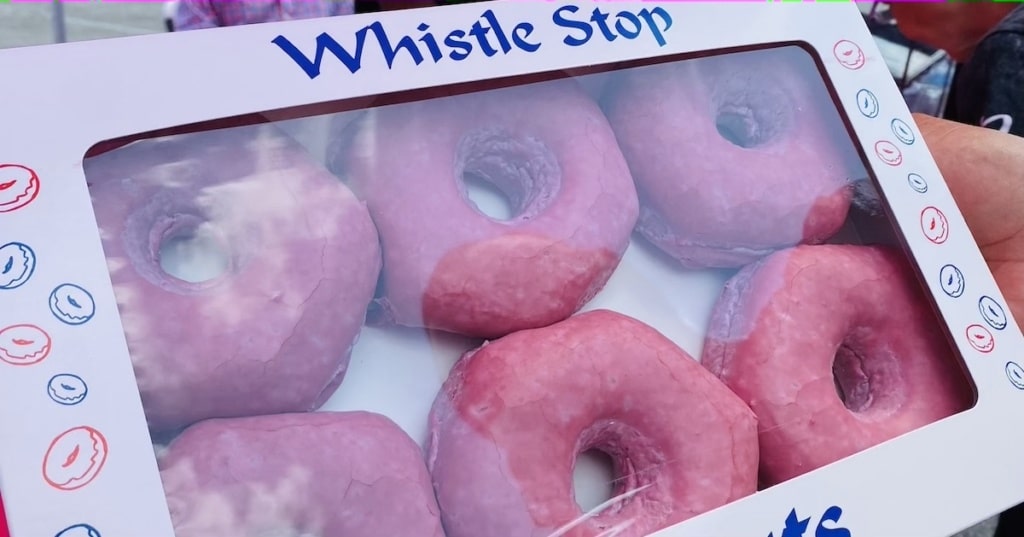 box of pink donuts