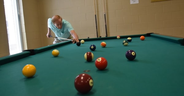 senior shooting pool feature