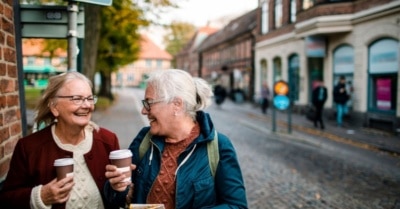 older adult women getting coffee