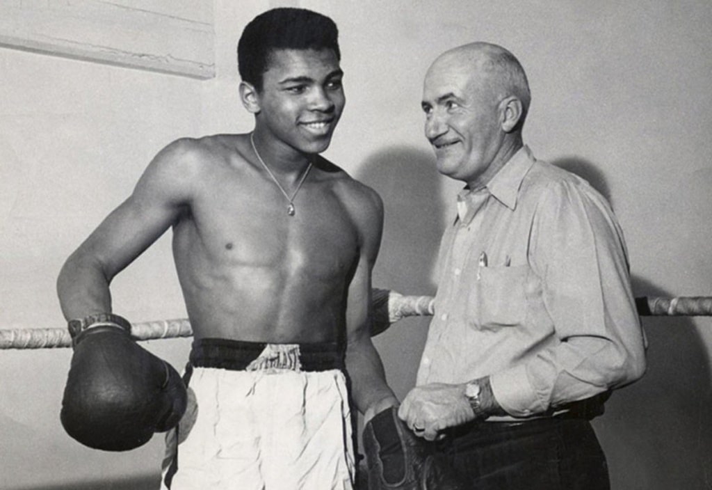 cassius clay with trainer