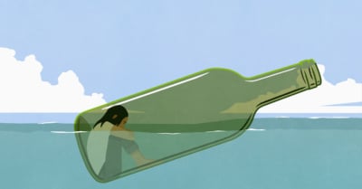 Depressed woman inside glass bottle floating in sea