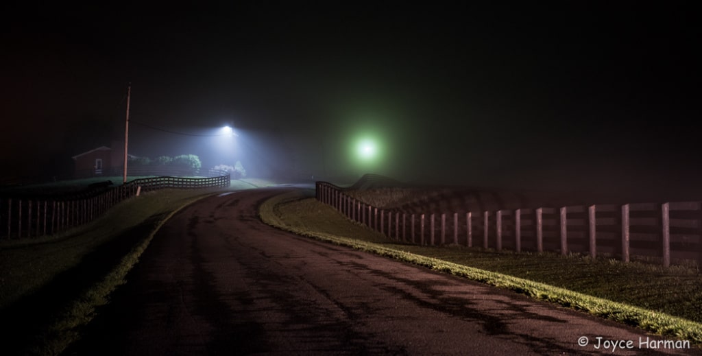 foggy night sky and road