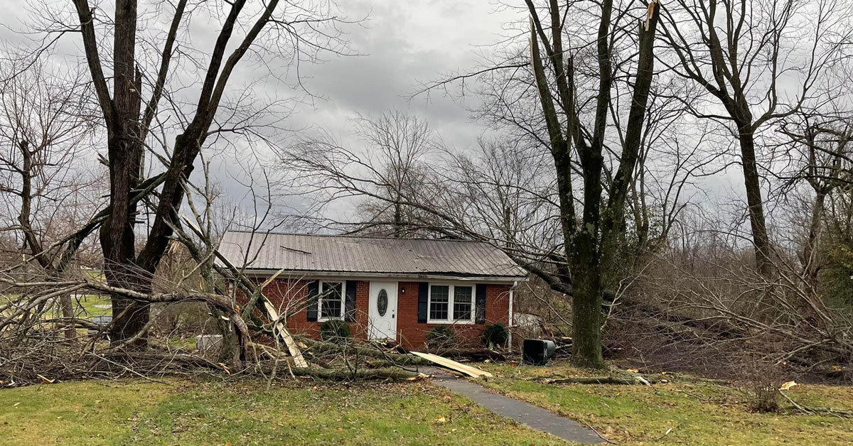 Fallen trees in front of a home in Pembroke, one of the areas hit hardest by the storms. (Pembroke Fire Department photo)