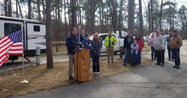 beshear in front of trailer in western kentucky