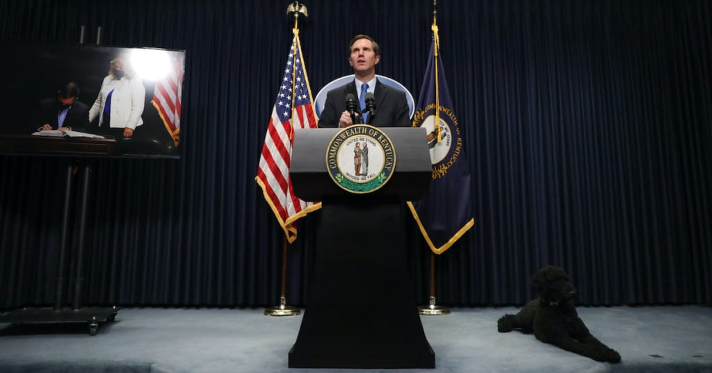 andy beshear at podium