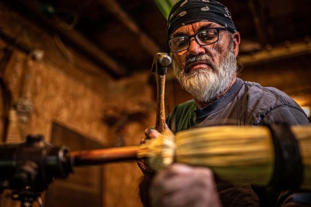 man making broom