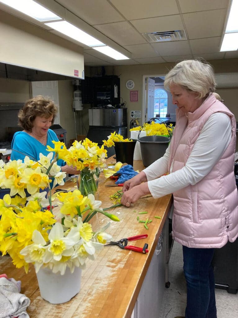 friends arranging daffodils