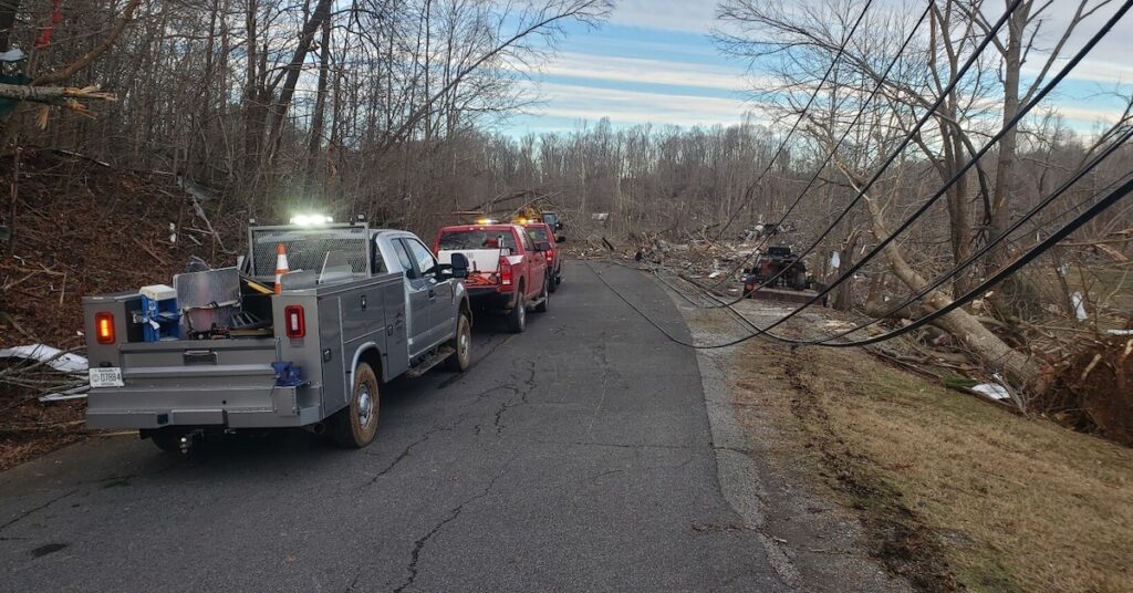 trucks cleaning up tornado debris