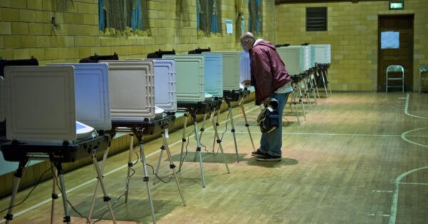 voter at voting booth in polling place