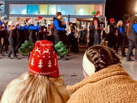 Spectators watch members of the Hopkinsville and Christian County marching bands during the Hopkinsville Christmas parade on Saturday, Dec. 11, 2021. (Photo by Jennifer P. Brown, Hoptown Chronicle)