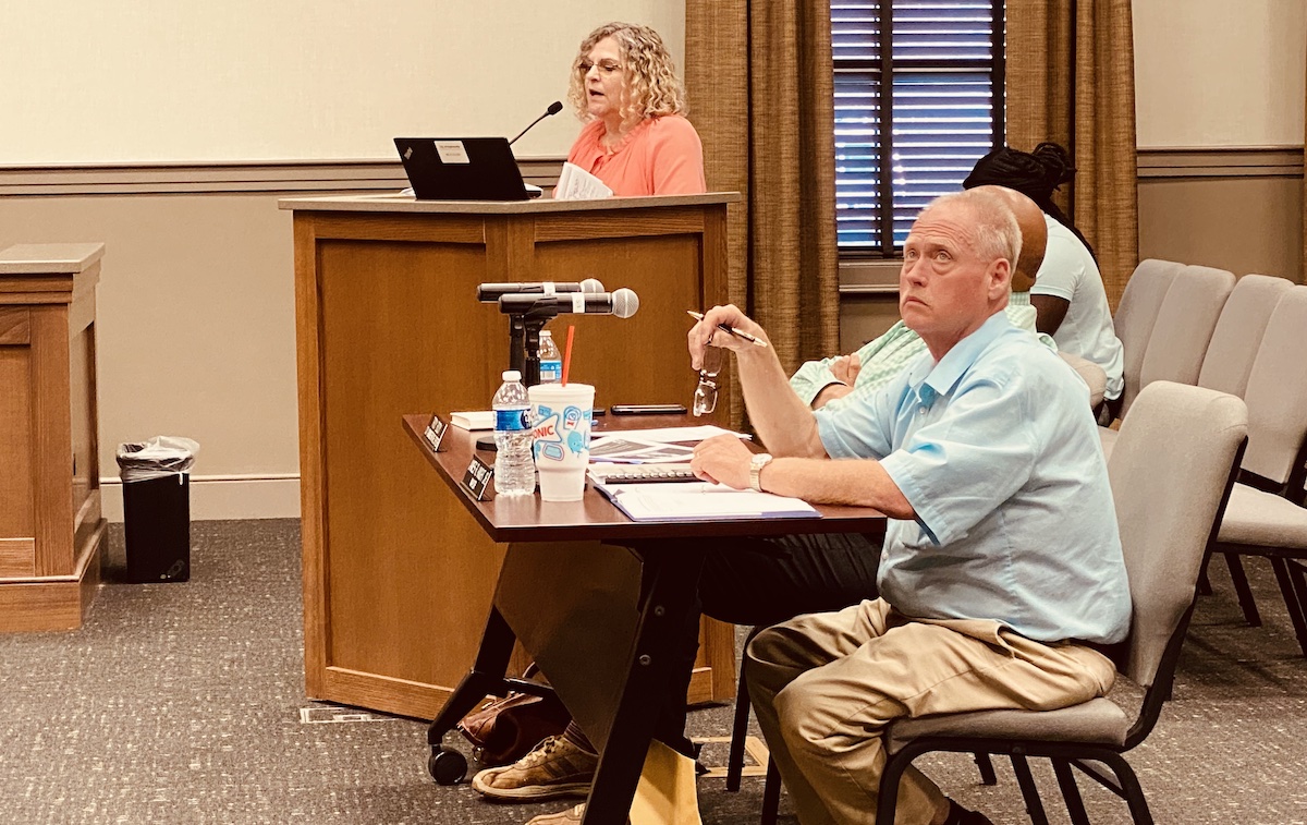 Mayor James R. Knight Jr. listens as city finance employee Melissa Clayton outlines the 2023-24 budget proposal for council members at a May 18, 2023, Committee of the Whole meeting. (Hoptown Chronicle photo by Jennifer P. Brown)