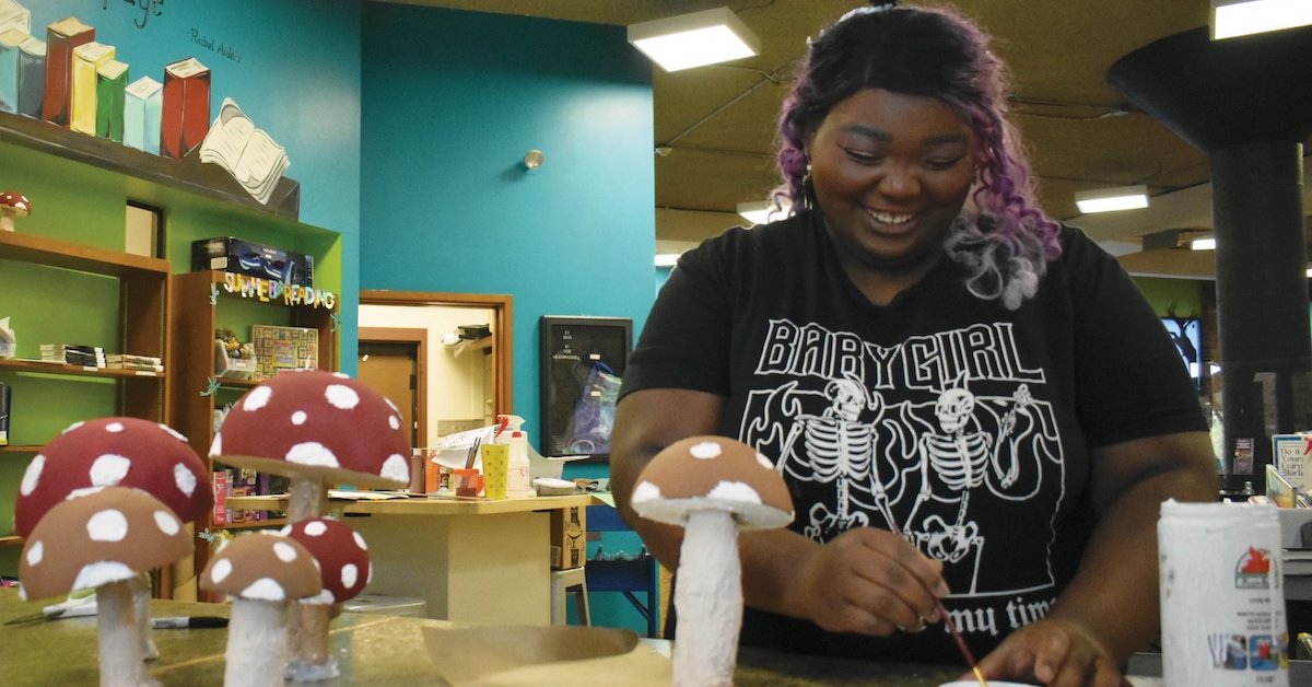 Library assistant Mejanae Wilson paints mushroom decorations for the 2023 Summer Reading Program at the Hopkinsville-Christian County Public Library. (Photo provided)