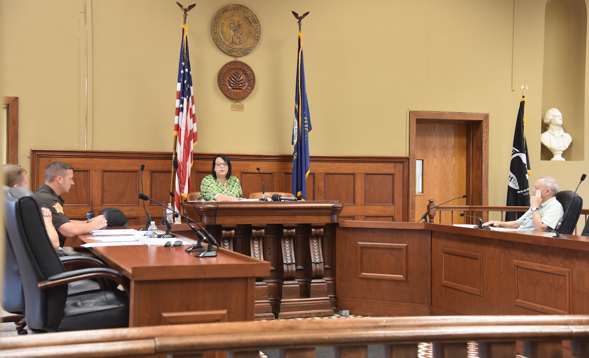 Christian County Board of Elections members (from left) Republican representative Philip Eastman, Sheriff Tyler Dearmond, County Clerk Melinda Humphries and Democratic representative Marvin Denison discuss polling locations at their July 25, 2023, meeting at the courthouse. (Hoptown Chronicle photo by Jennifer P. Brown)
