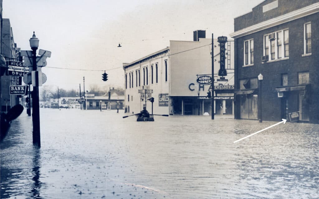 man canoeing downtown during 1957 hopkinsville flood