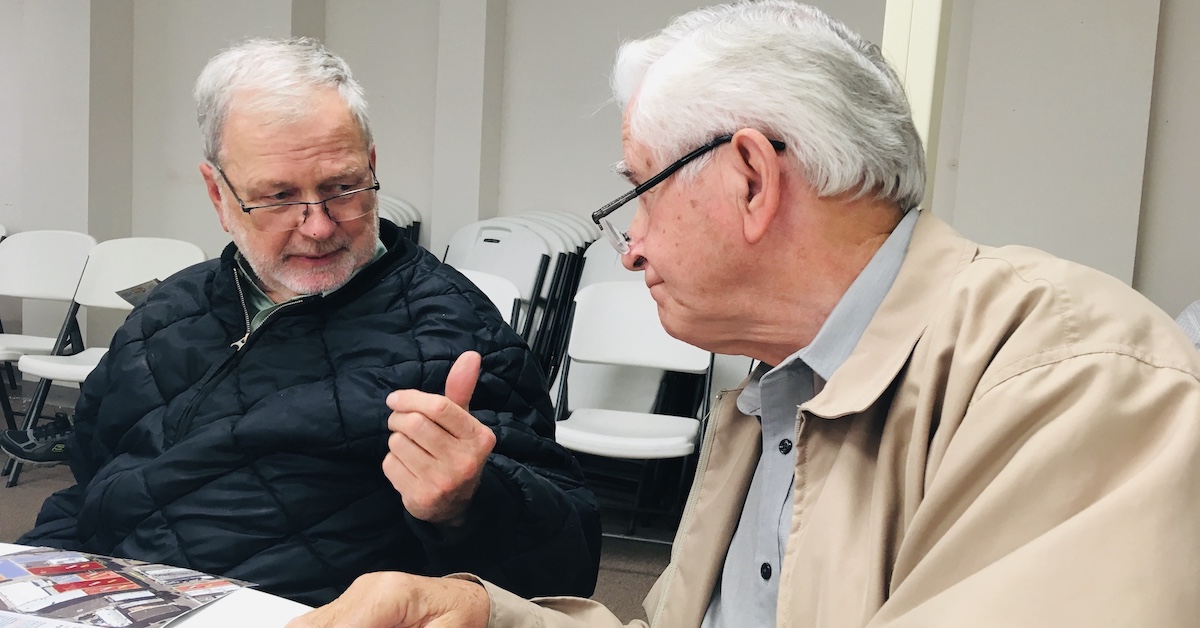 Ben Wood (left) speaks with Christian County Historian William T. Turner during an auction on Nov. 20, 2018, for several commercial properties in downtown Hopkinsville. (Hoptown Chronicle photo by Jennifer P. Brown)