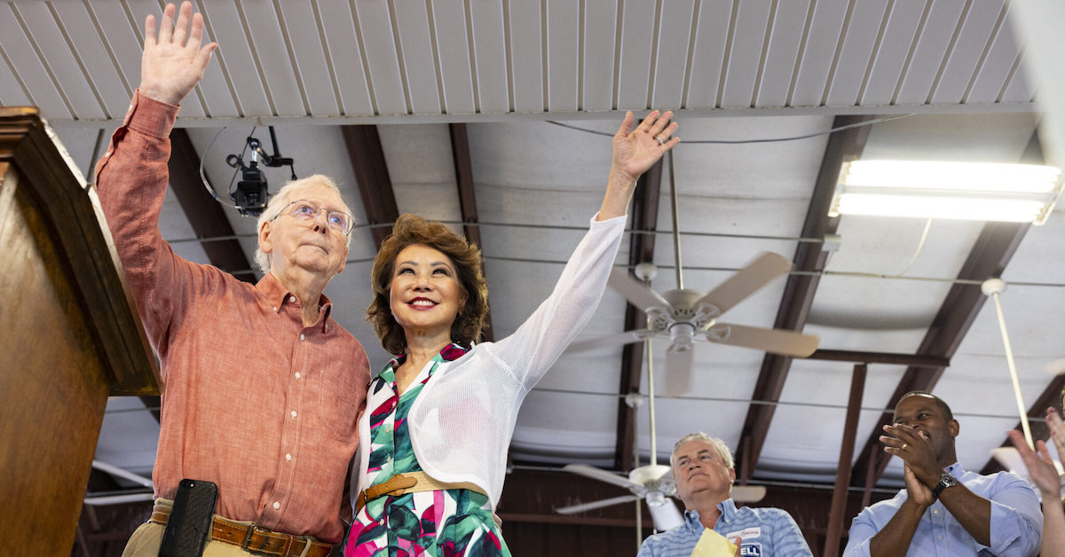 Sen. Mitch McConnell and wife Elaine Chao wave to the crowd during the 143rd Fancy Farm Picnic on Saturday, Aug. 5, 2023. (Kentucky Lantern photo by Austin Anthony)