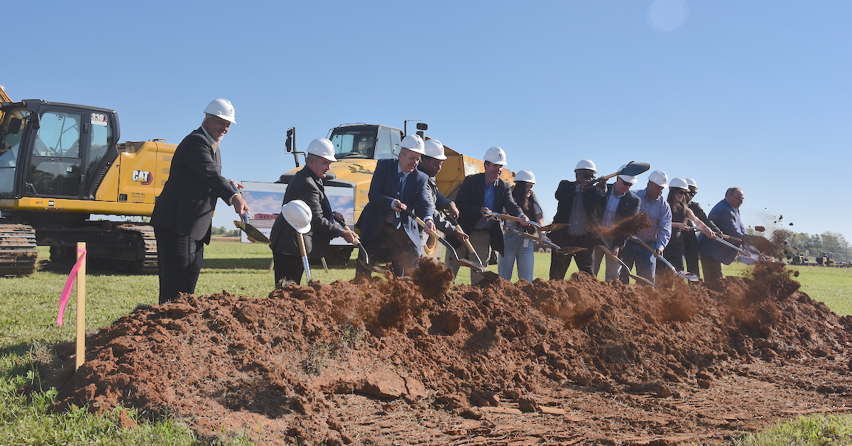 Gov. Andy Beshear, Superintendent Chris Bentzel, school board members and two high school students, Kaley Bangor and Stephan Lovan, were among the first dignitaries to toss dirt Friday, Sept. 15, 2023, at the ceremonial groundbreaking for the new Christian County High School.  (Hoptown Chronicle photo by Jennifer P. Brown)