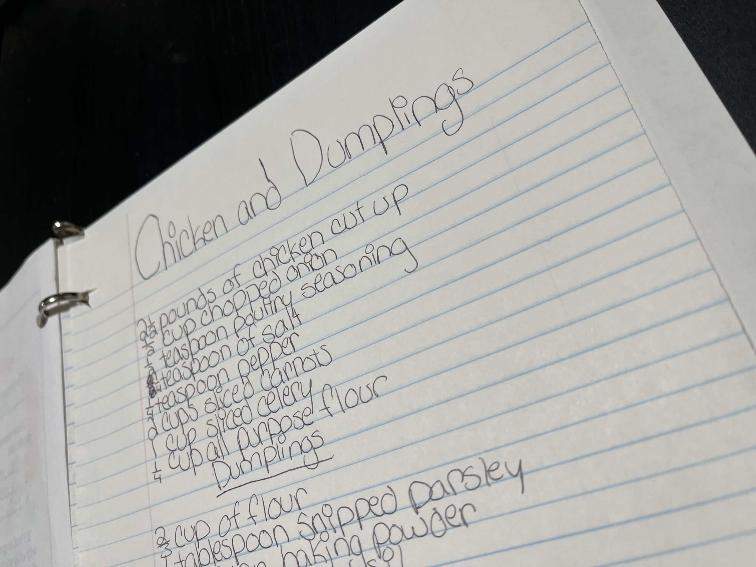 Chicken and dumplings recipe on lined paper