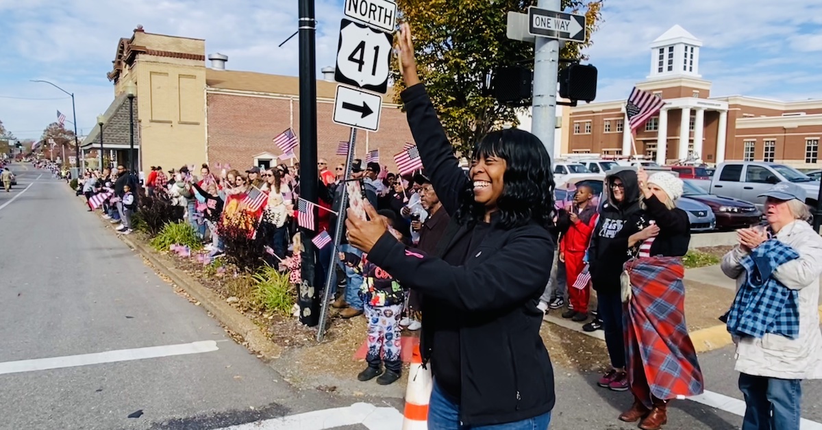 parade spectator waving