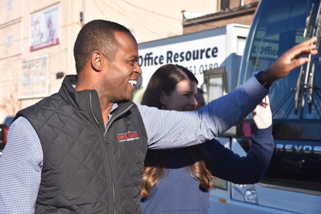 daniel cameron outside of campaign bus