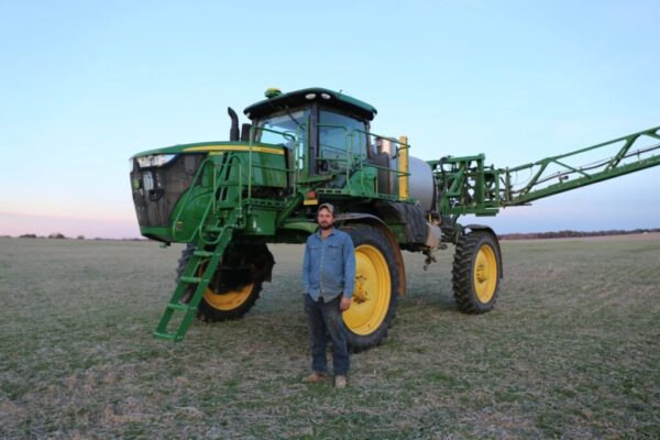 farmer in front of tractor