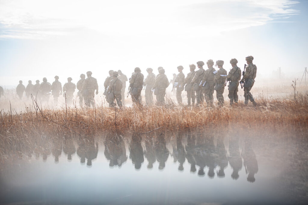 soldiers walking in fog