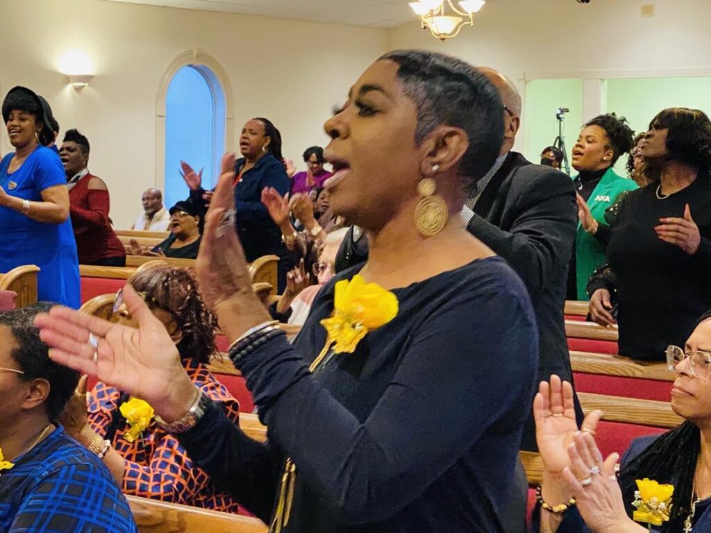 woman clapping at mlk service