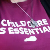 woman wearing childcare shirt
