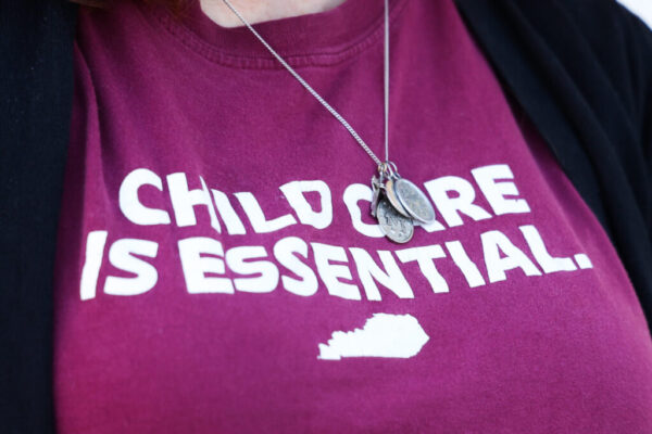 woman wearing childcare shirt