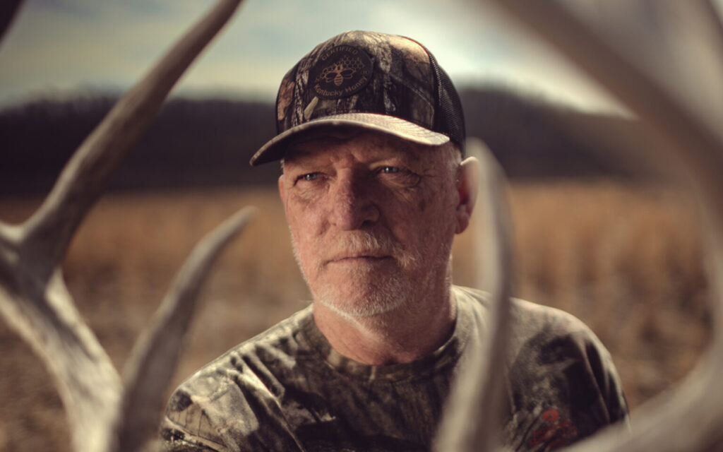 After his appointment to the Fish and Wildlife Commission was derailed, Tom Ballinger decided to challenge Sen. Stephen Meredith for his Senate seat. They are both Republicans. Ballinger, framed by deer antlers, was photographed on his farm in Butler County , March 24, 2024. (Kentucky Lantern photo by Austin Anthony)