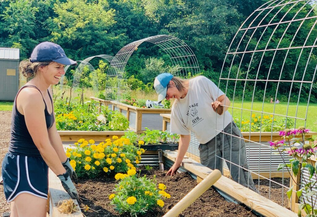 Volunteers prepare beds at Mitchell Giving Gardens, a community garden in Spruce Pine, North Carolina. (Photo by Jess Lanning)