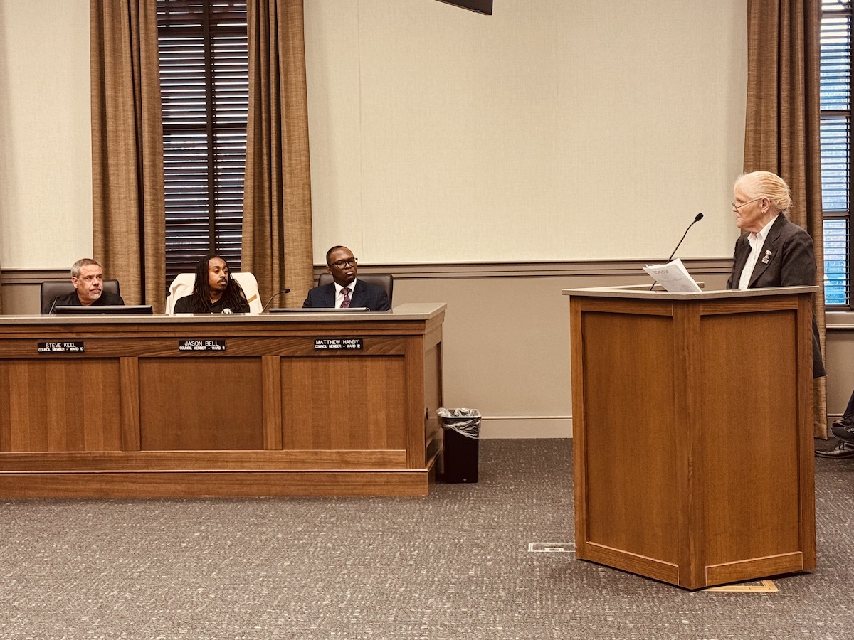 Peg Hays, who chairs the Local Development Corp., gives a statement calling on Hopkinsville City Councilman  Steve Keel (far left) to apologize for his treatment of Downtown Renaissance Director Holly Boggess during budget discussions at a Committee of the Whole meeting on May 9. Seated beside Keel are council members Jason Bell (left) and Matthew Handy. (Hoptown Chronicle photo by Jennifer P. Brown)