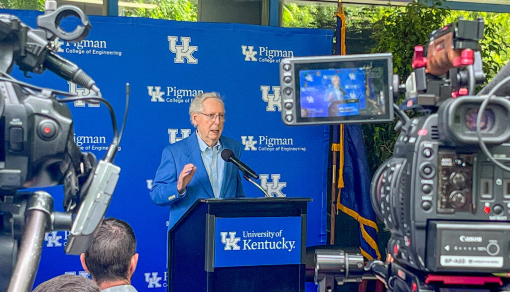 Mitch McConnell in front of UK backdrop