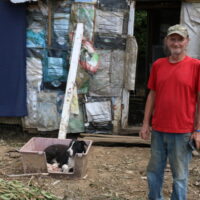 tornado victim in front of debris