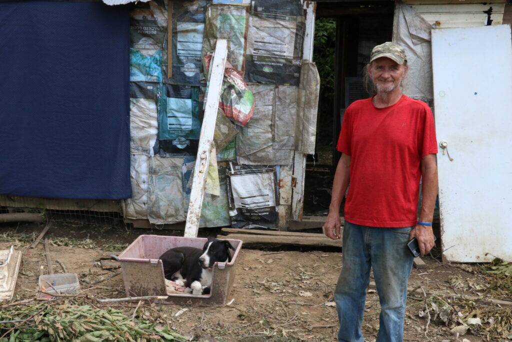 tornado victim in front of debris