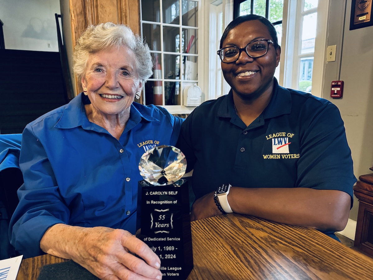 Carolyn Self, a member of the Hopkinsville League of Women Voters for 55 years, received an award in recognition of her dedicated service, during a league meeting Monday, July 8, 2024, at The Corner Coffeehouse. League president Nikki Chambers posed with Self for a photo after the meeting. (Hoptown Chronicle photo by Jennifer P. Brown)