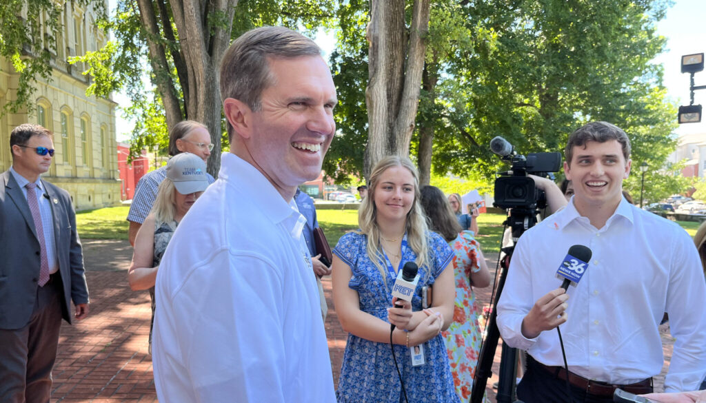 Kentucky Governor Andy Beshear with reporters