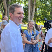 andy beshear smiling outside