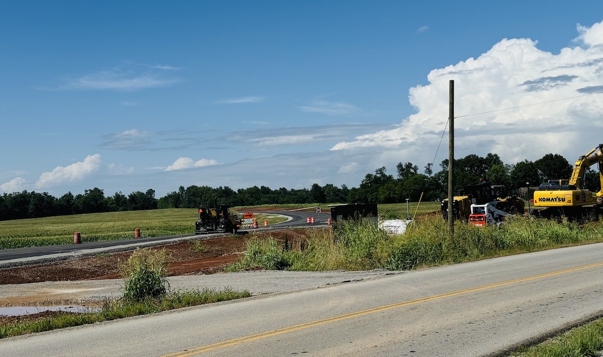 An industrial connector road, seen here on July 9, 2024, adjacent to Kentucky 115 at Pembroke near Rosedale Cemetery, will link Interstate 24 to Commerce Park and Commerce Park II near Pembroke Road. (Hoptown Chronicle photo by Jennifer P. Brown)