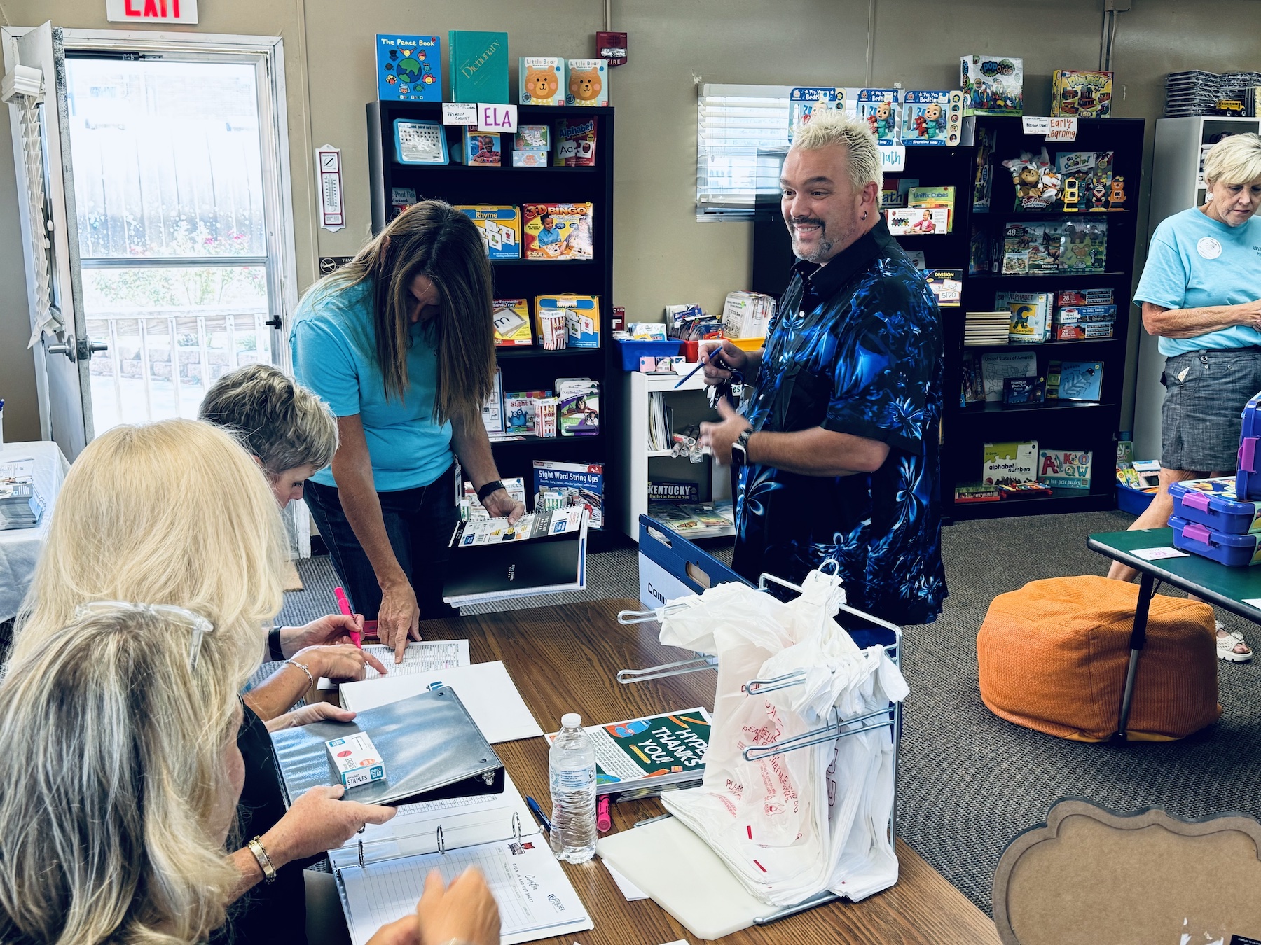 Adam Barnes, who teaches culinary arts, was the first local teacher to pick up free supplies in the new Teacher Corner when it opened Tuesday, Aug. 27, 2024. (Hoptown Chronicle photo by Jennifer P. Brown)