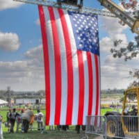 forklift holding an American flag