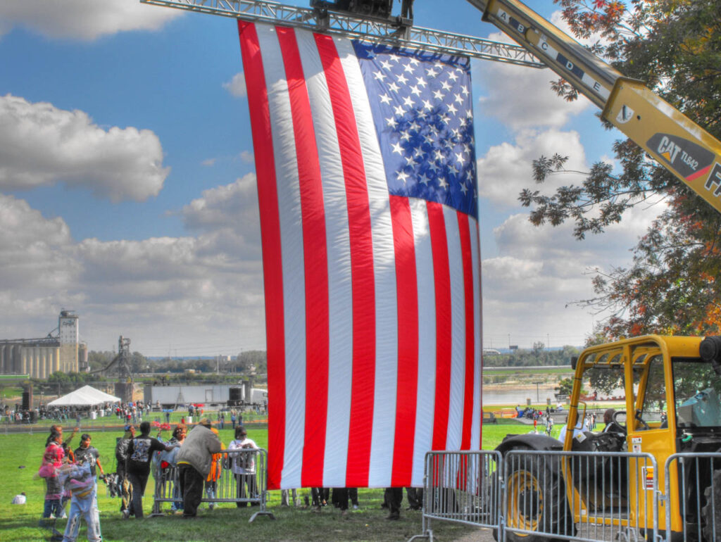 forklift holding an American flag