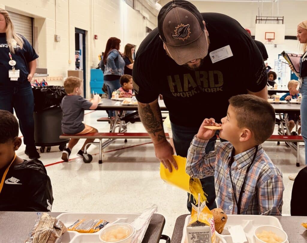 dad speaking to preschooler during lunch