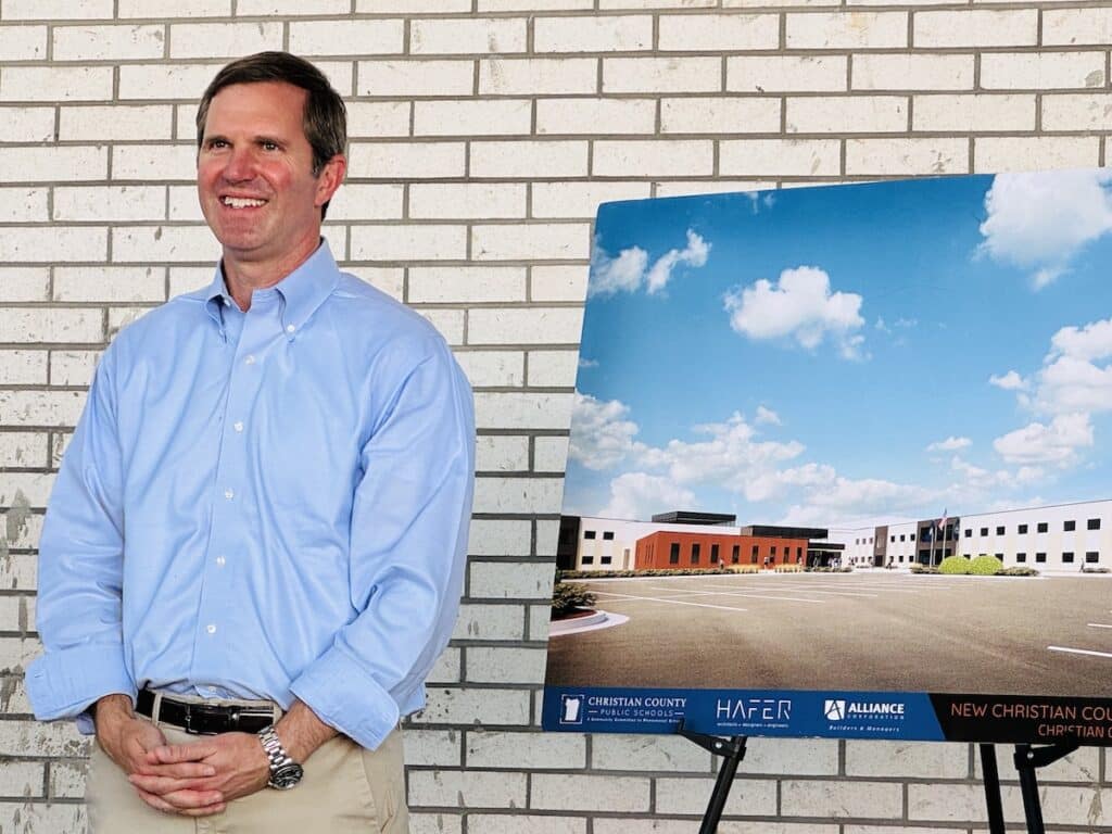 andy beshear next to christian county school rendering